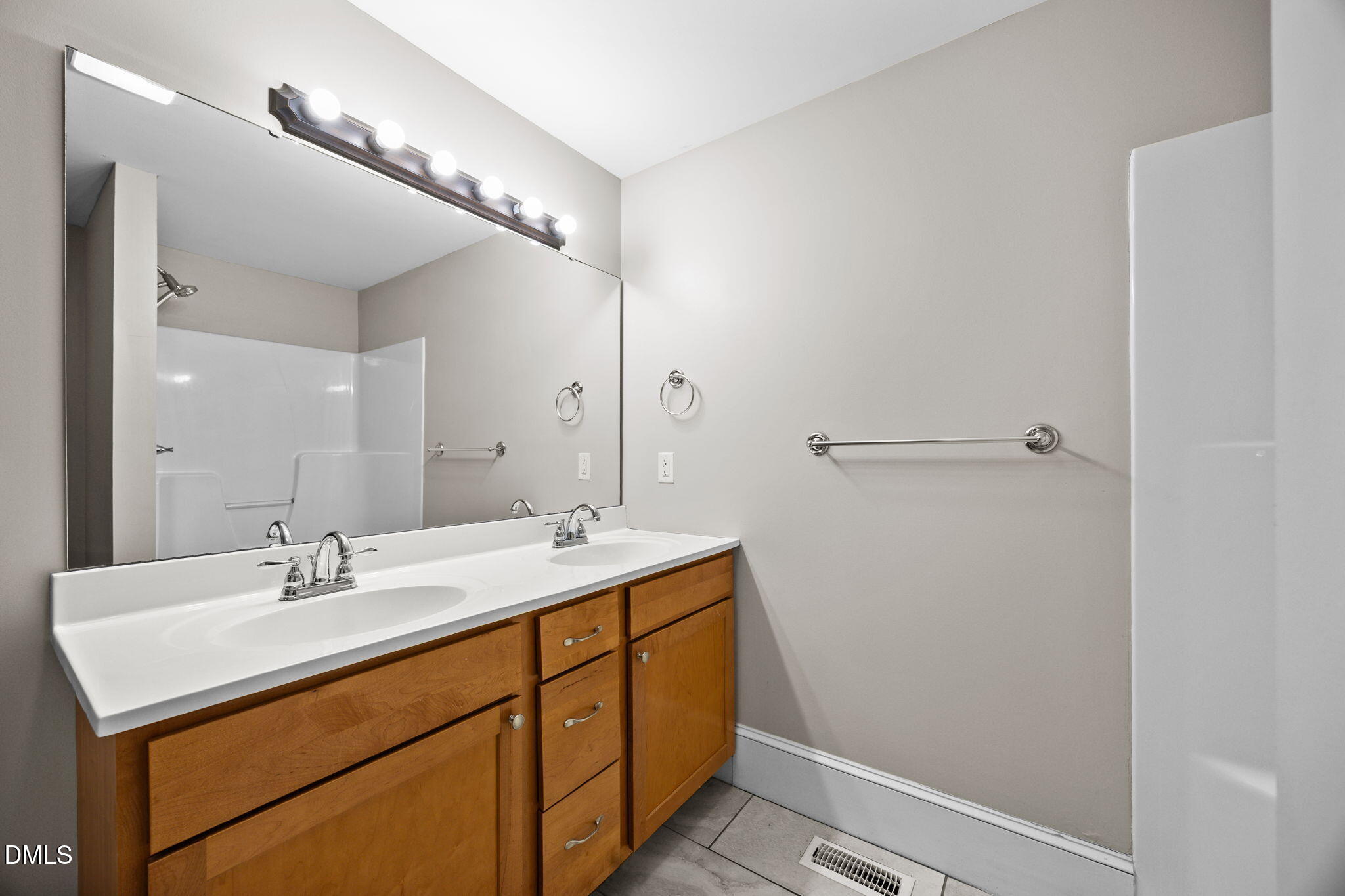 5869 Deans Street Bailey, NC 27807 - Photo 38 of 62 a bathroom with a sink vanity and a mirror