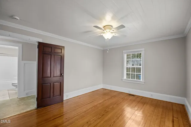a view of a house with a wooden deck