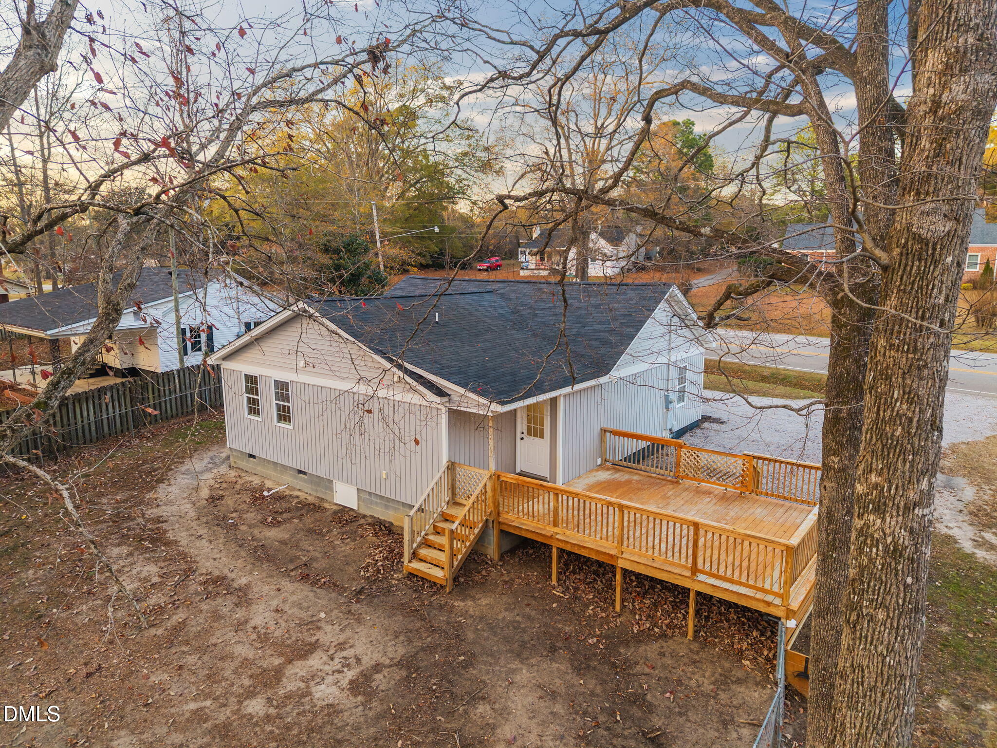 5869 Deans Street Bailey, NC 27807 - Photo 55 of 62 a view of a house with a yard and wooden fence