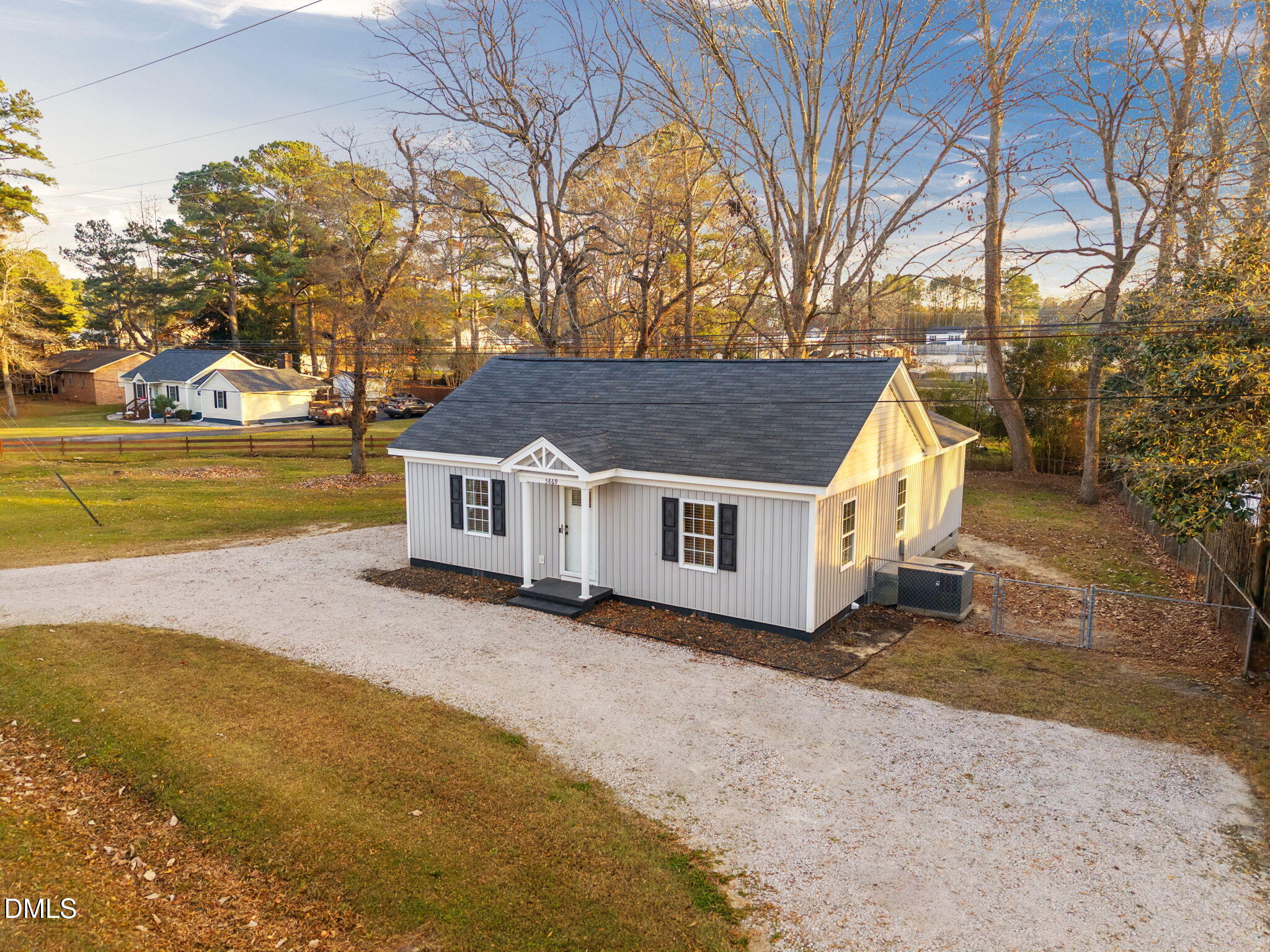 5869 Deans Street Bailey, NC 27807 - Photo 6 of 62 a view of a house with a yard covered with snow in front of house