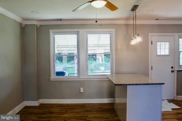 a view of a bathroom from a corridor