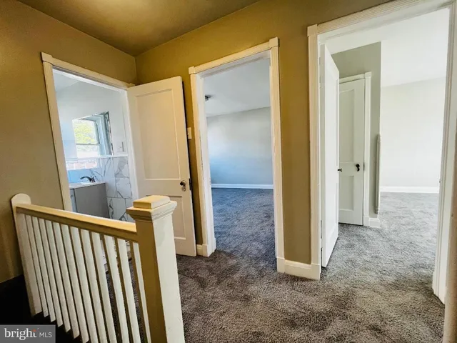 a view of an empty room with stairs