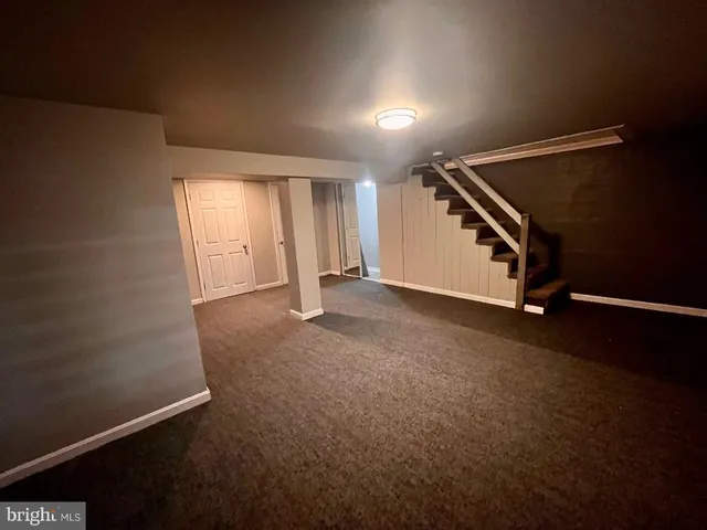 an empty room with wooden floor