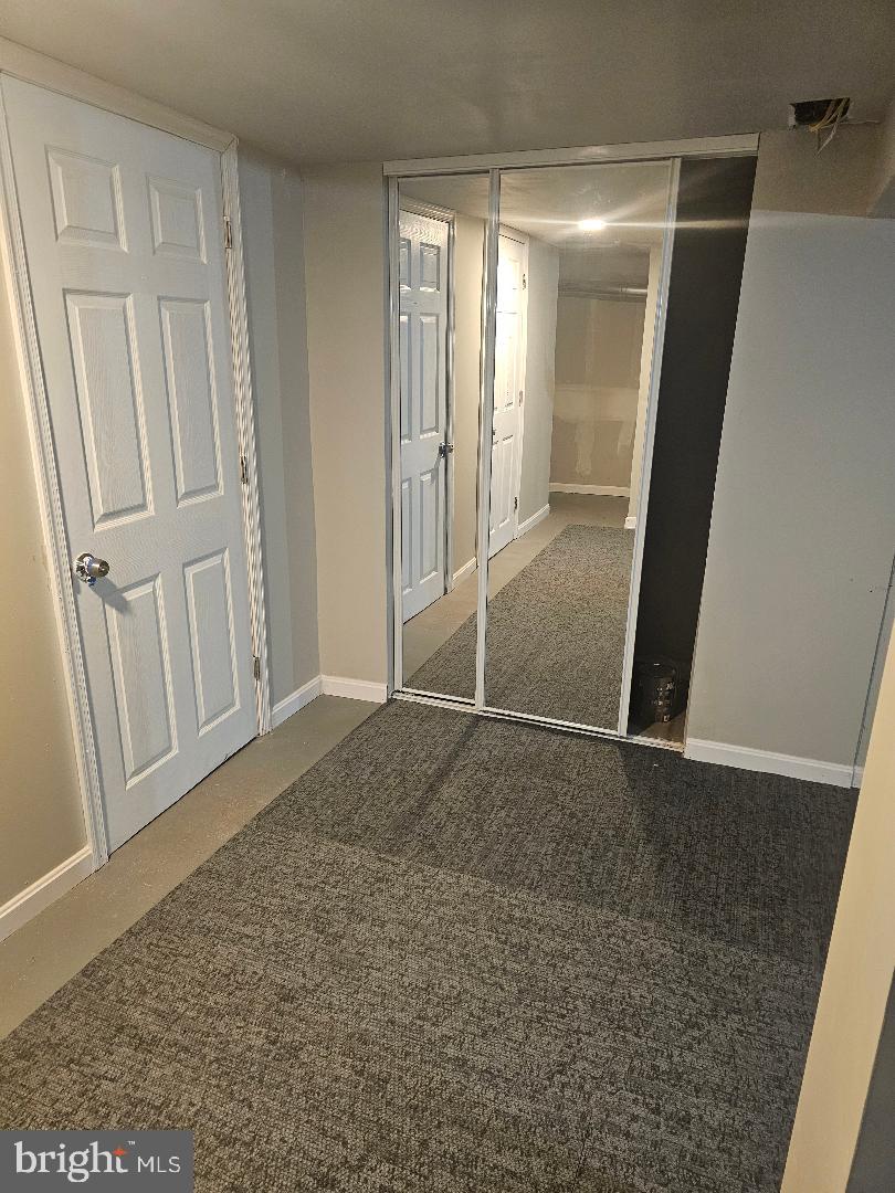 506 Allendale Street Baltimore, MD 21229 - Photo 25 of 27 an empty room with wooden floor