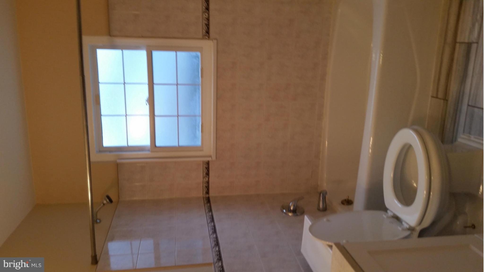 337 Bryanstone Road Reisterstown, MD 21136 - Photo 11 of 25 a bathroom with a sink and a shower
