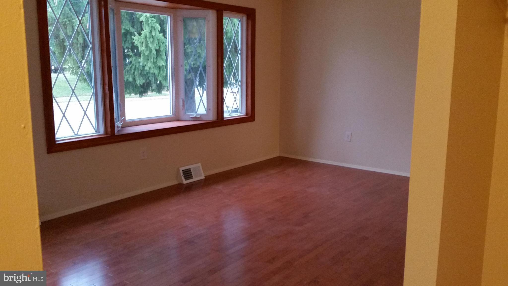 337 Bryanstone Road Reisterstown, MD 21136 - Photo 16 of 25 a view of a room with wooden floor and windows