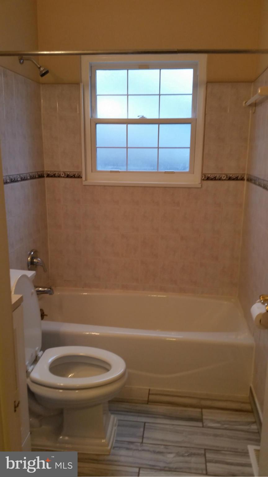 337 Bryanstone Road Reisterstown, MD 21136 - Photo 19 of 25 a bathroom with a toilet a sink and a shower