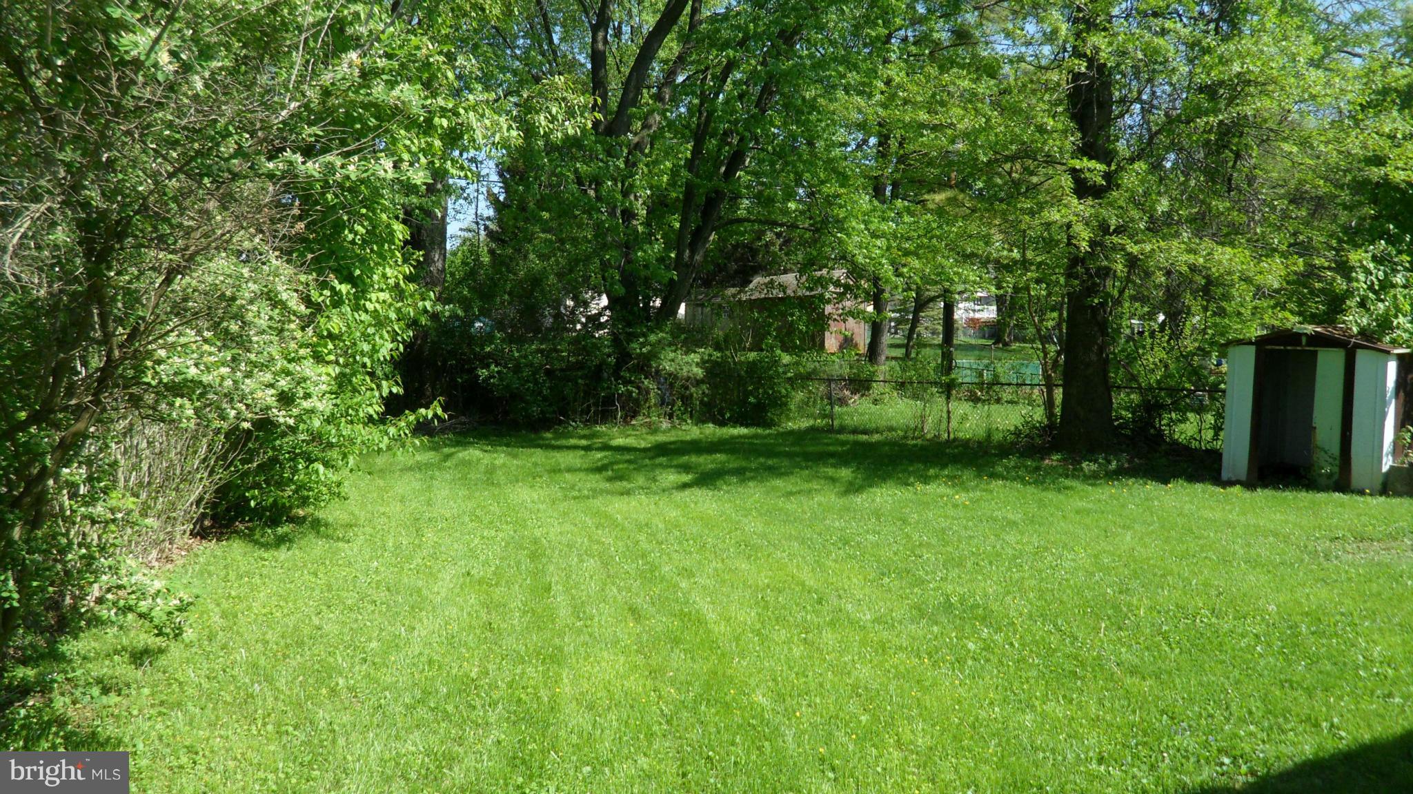 337 Bryanstone Road Reisterstown, MD 21136 - Photo 3 of 25 a view of a backyard with large trees