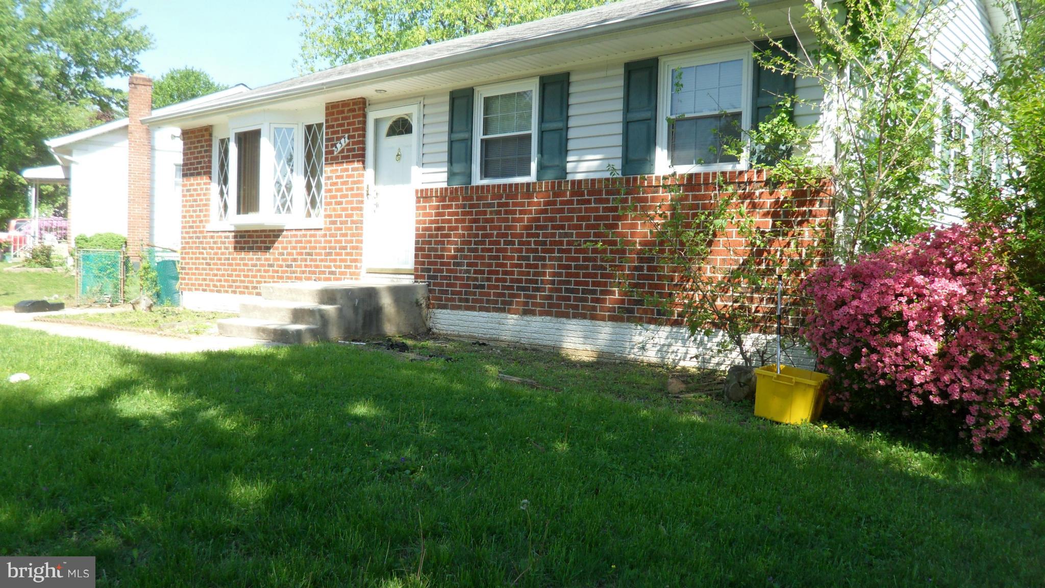 337 Bryanstone Road Reisterstown, MD 21136 - Photo 4 of 25 a front view of a house with a garden