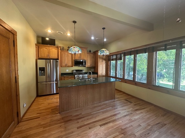 230 Comstock Street, Unit 1 Joliet, IL 60436 - Photo 4 of 20 a view of kitchen with cabinets and wooden floor