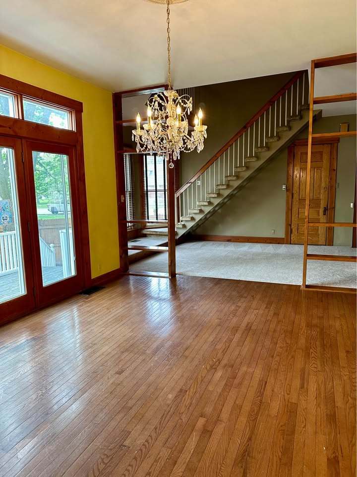 230 Comstock Street, Unit 1 Joliet, IL 60436 - Photo 5 of 20 a view of entryway and hall with wooden floor