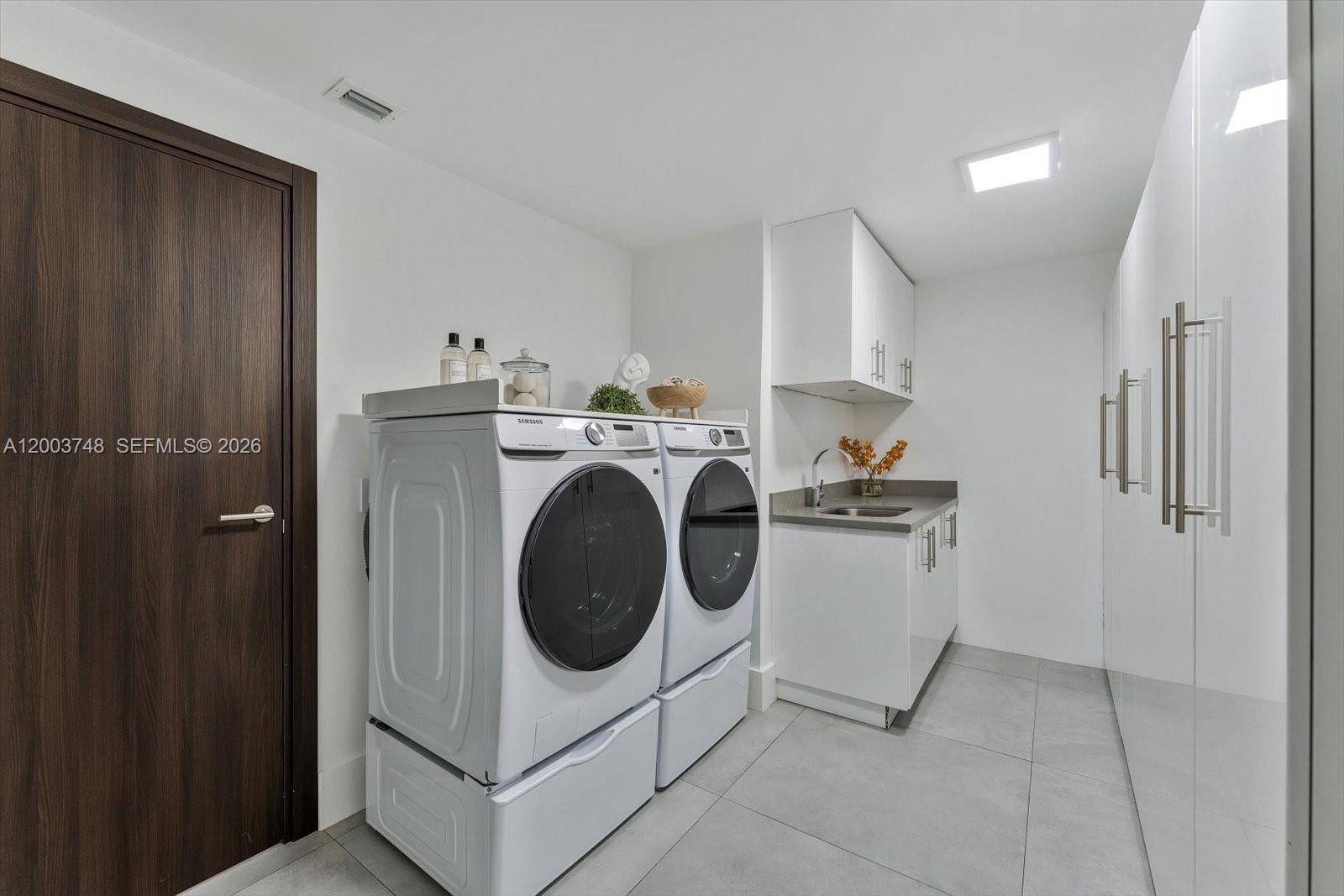 2675 Hackney Road Weston, FL 33331 - Photo 56 of 61 a utility room with dryer and washer