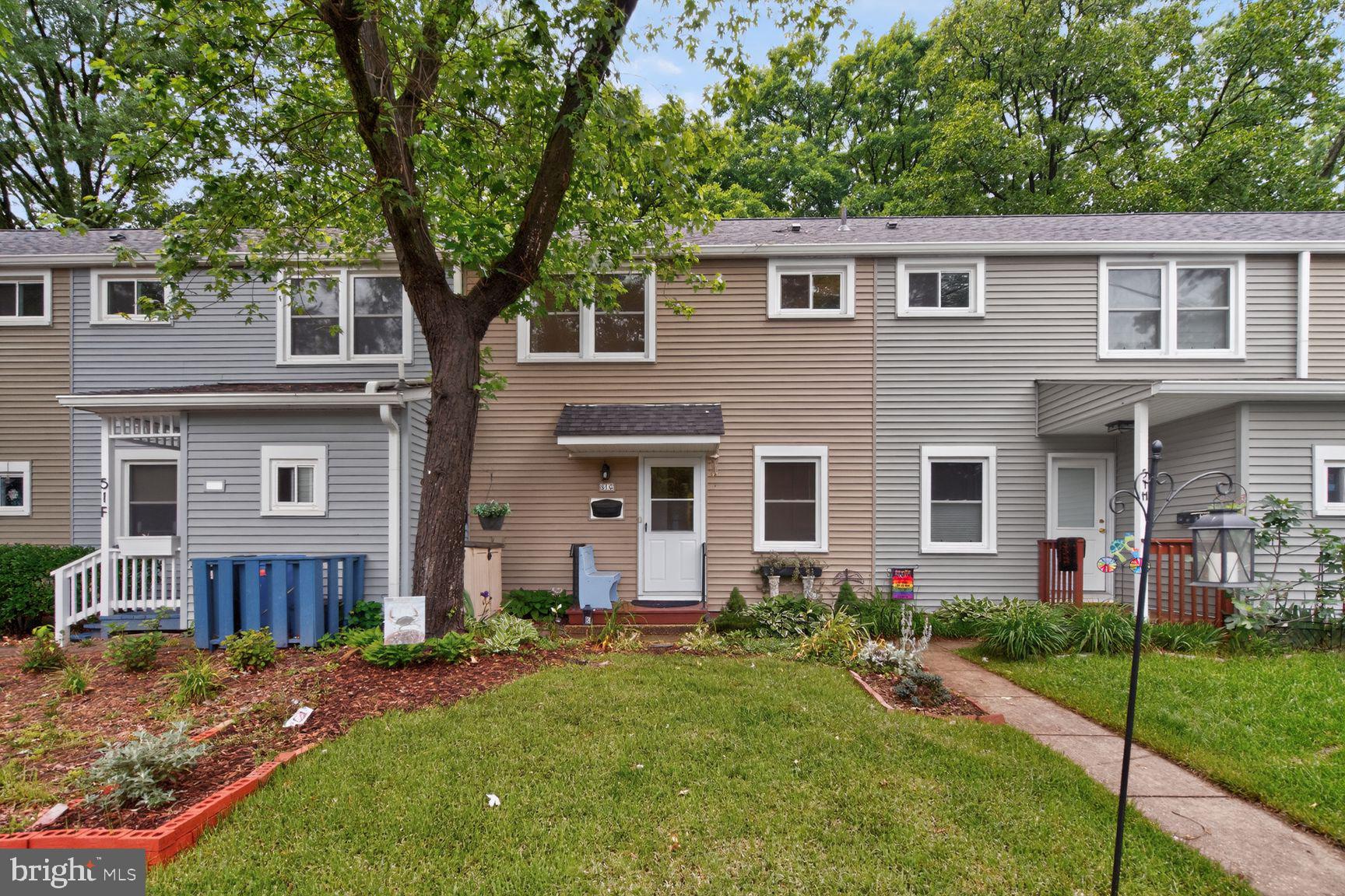 51 Ridge Road Greenbelt, MD 20770 - Photo 18 of 23 a front view of a house with a yard and porch