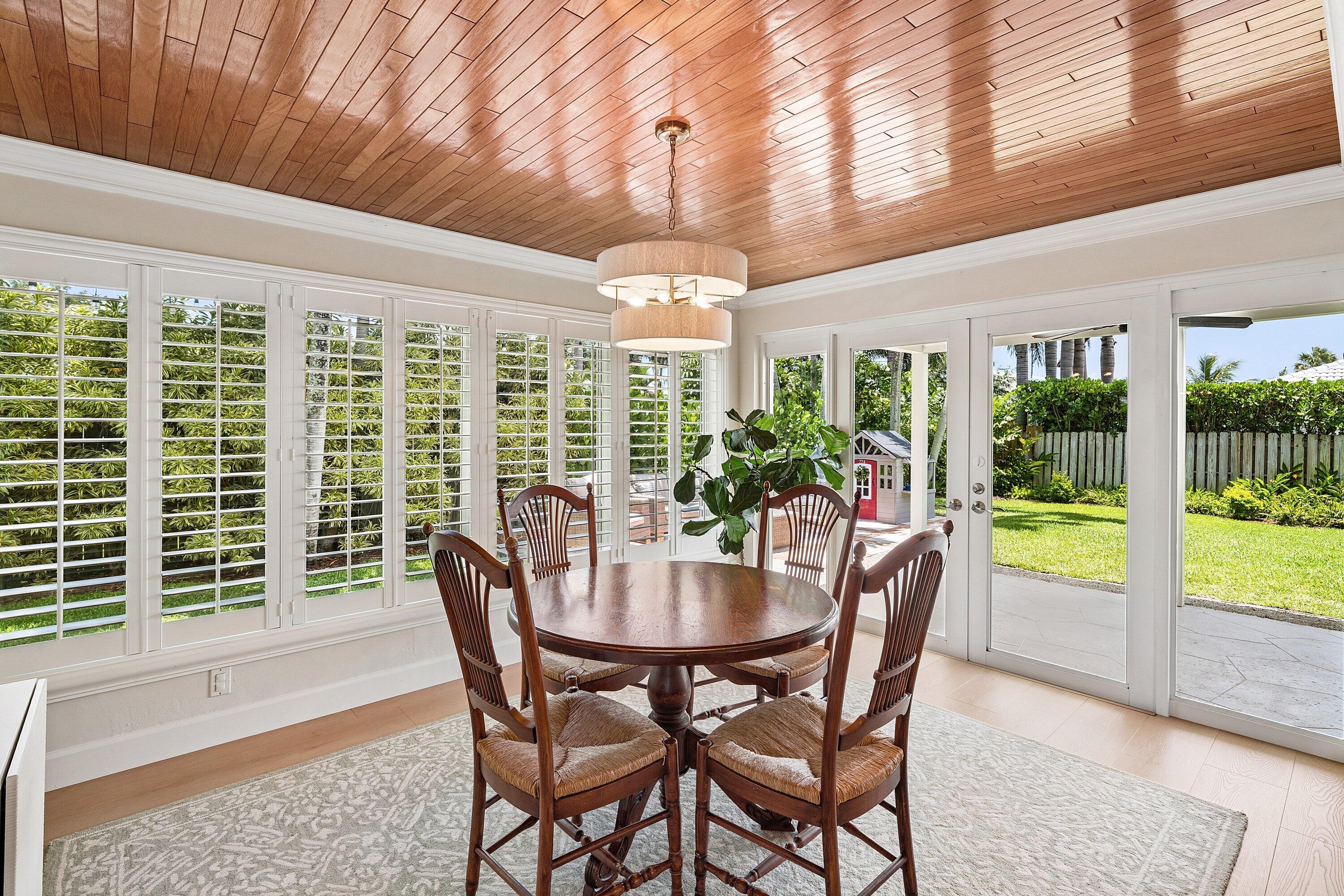 774 Southwest 7th Street Boca Raton, FL 33486 - Photo 18 of 28 a view of a dining room with furniture window and wooden floor