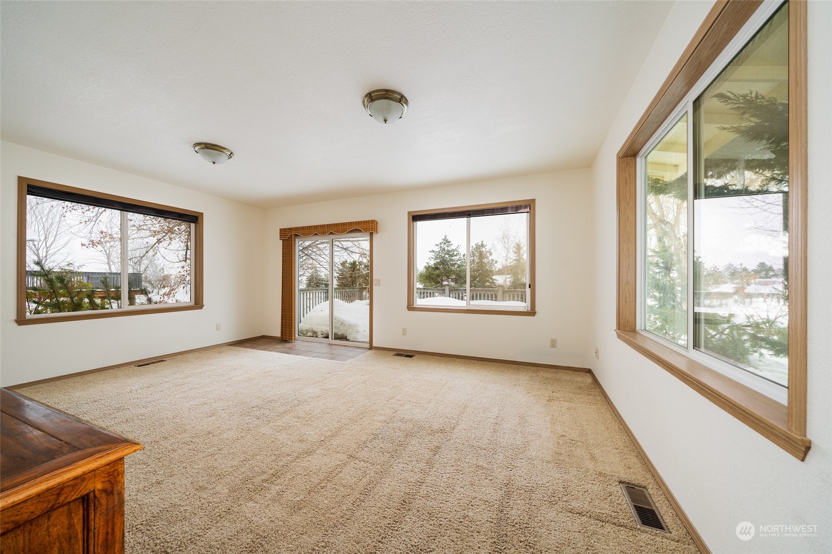 141 Johnson Creek Road Omak, WA 98841 - Photo 21 of 40 wooden floor in an empty room with a window