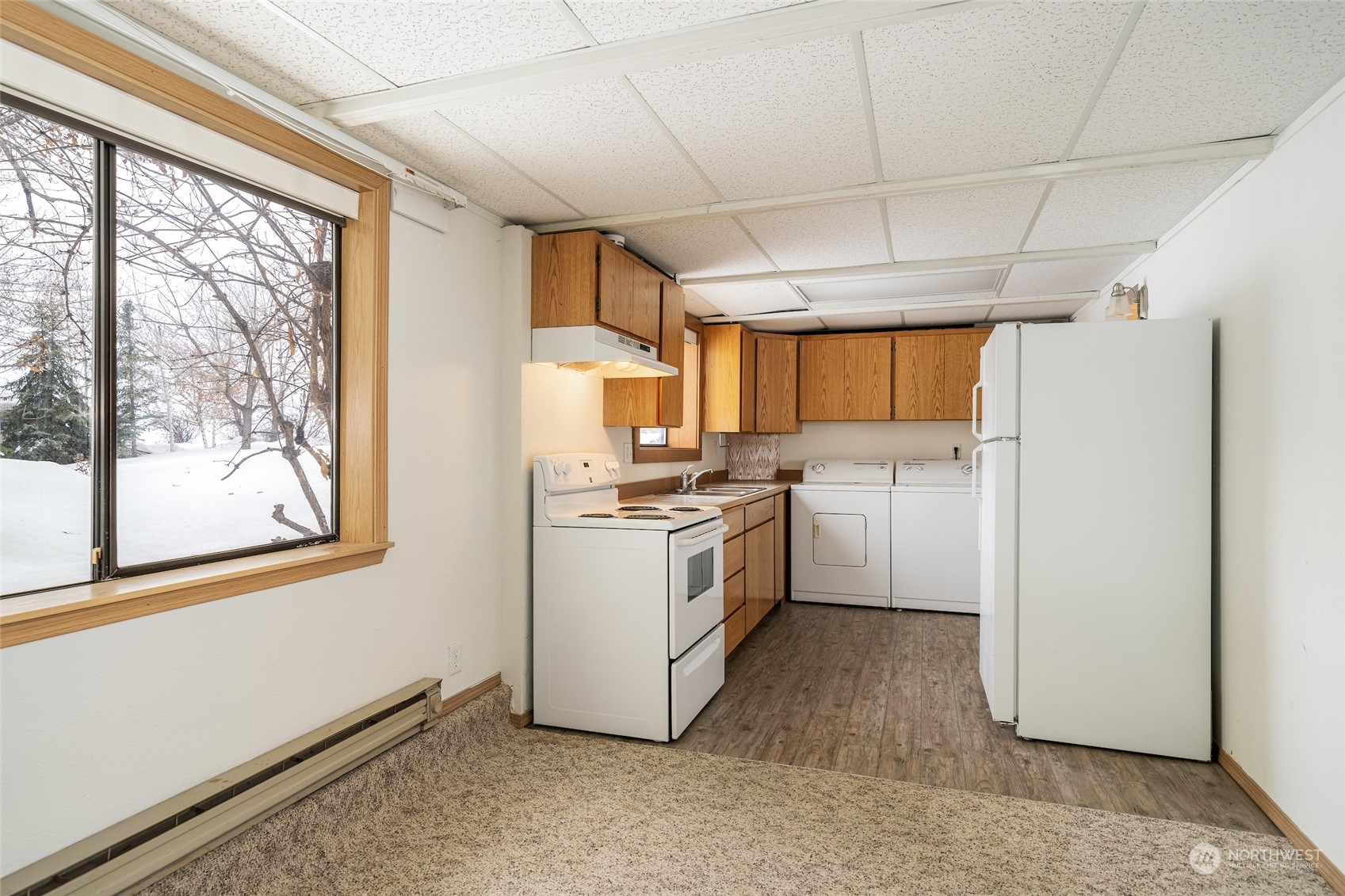 141 Johnson Creek Road Omak, WA 98841 - Photo 22 of 40 a kitchen with a refrigerator sink and cabinets