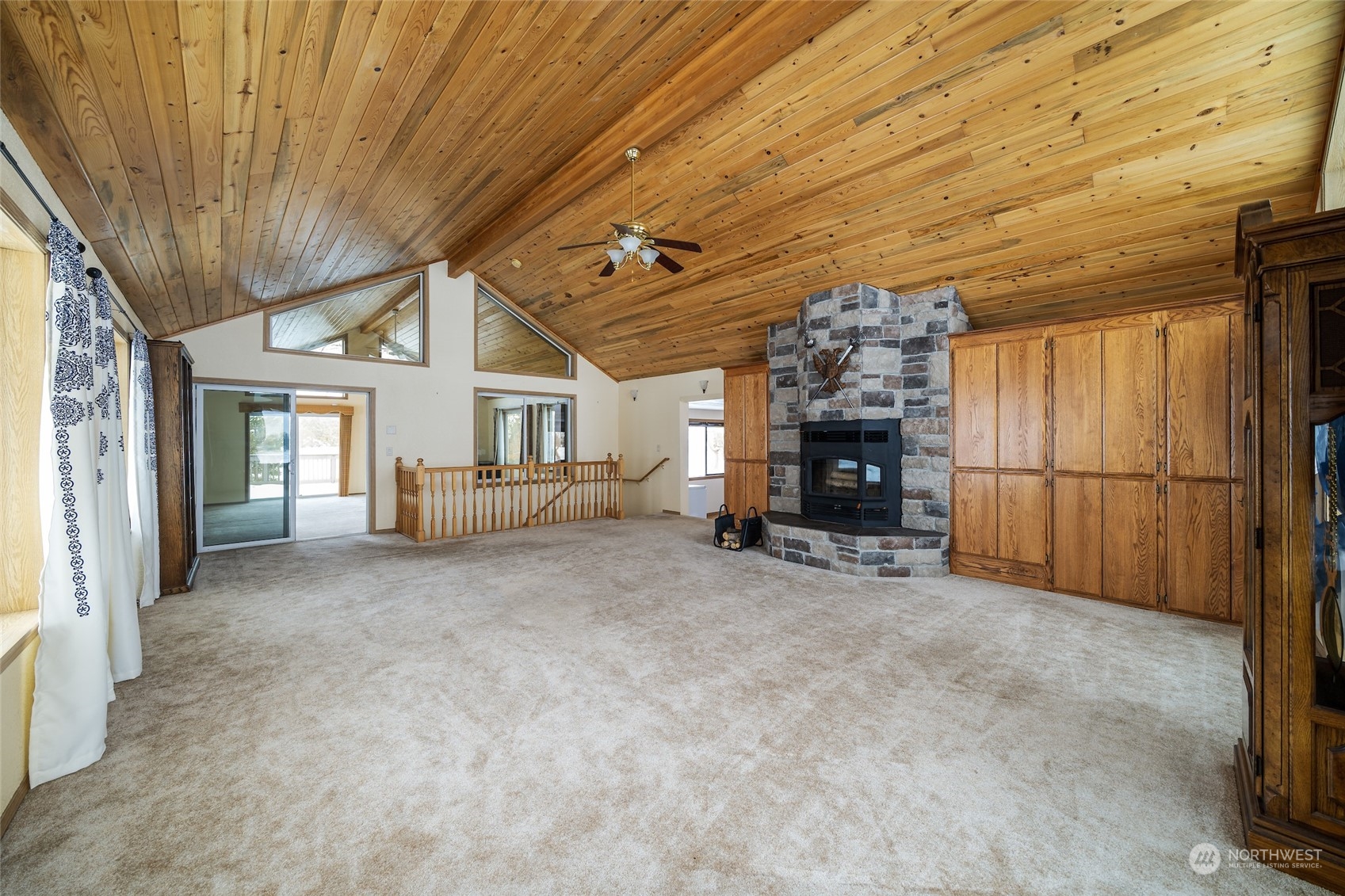 141 Johnson Creek Road Omak, WA 98841 - Photo 24 of 40 a view of a livingroom with fireplace and chandelier