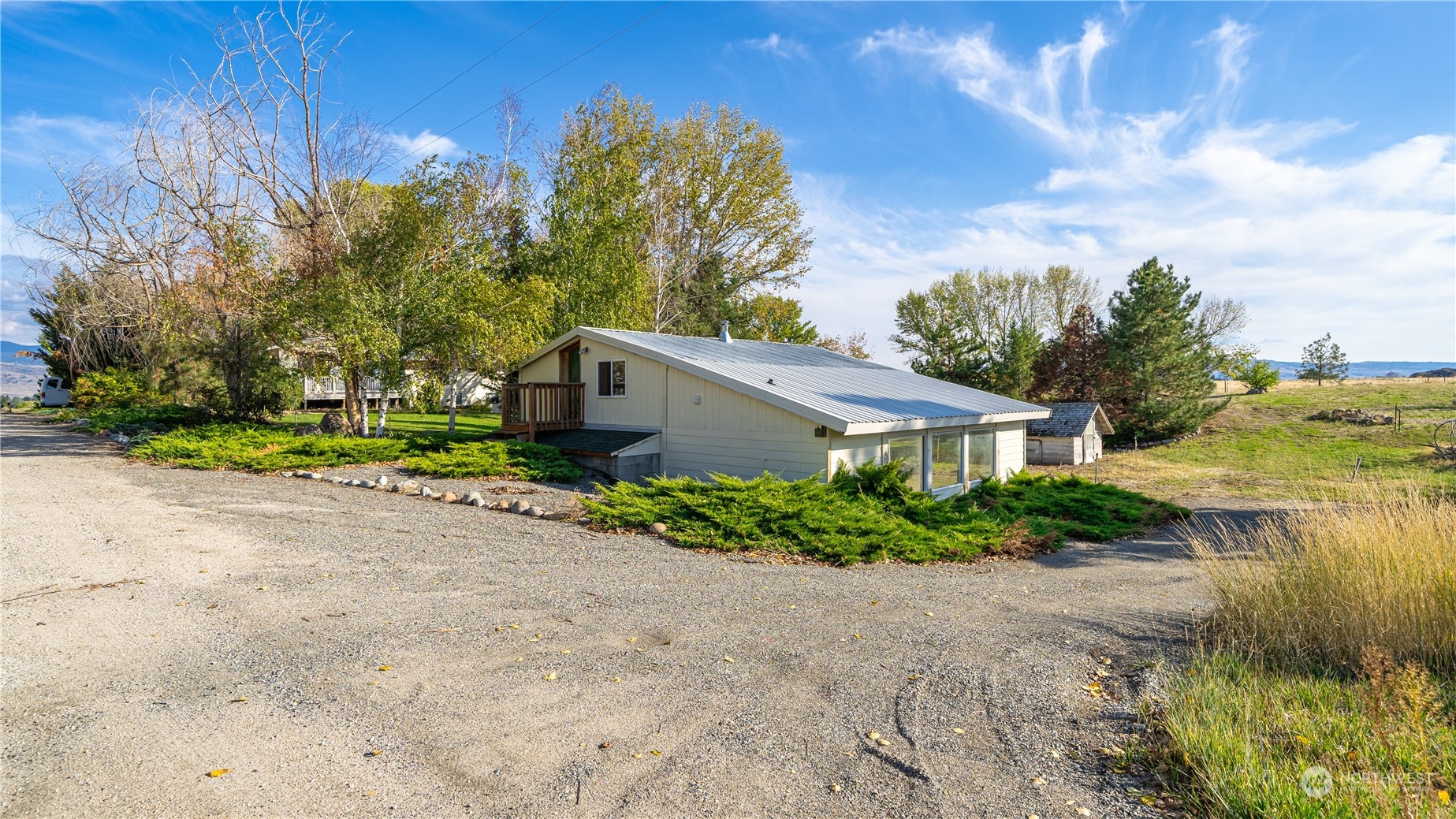 141 Johnson Creek Road Omak, WA 98841 - Photo 40 of 40 a front view of a house with a yard and shrubs