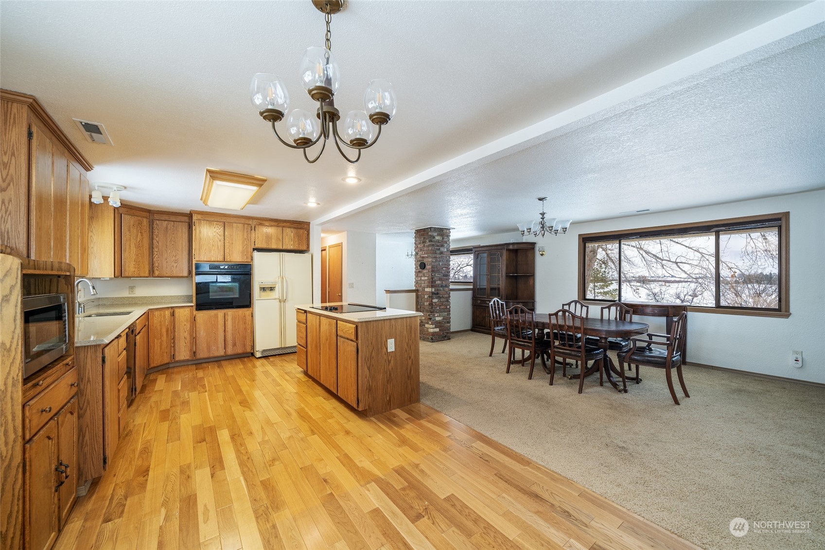 141 Johnson Creek Road Omak, WA 98841 - Photo 6 of 40 a view of a dining room with furniture window and wooden floor