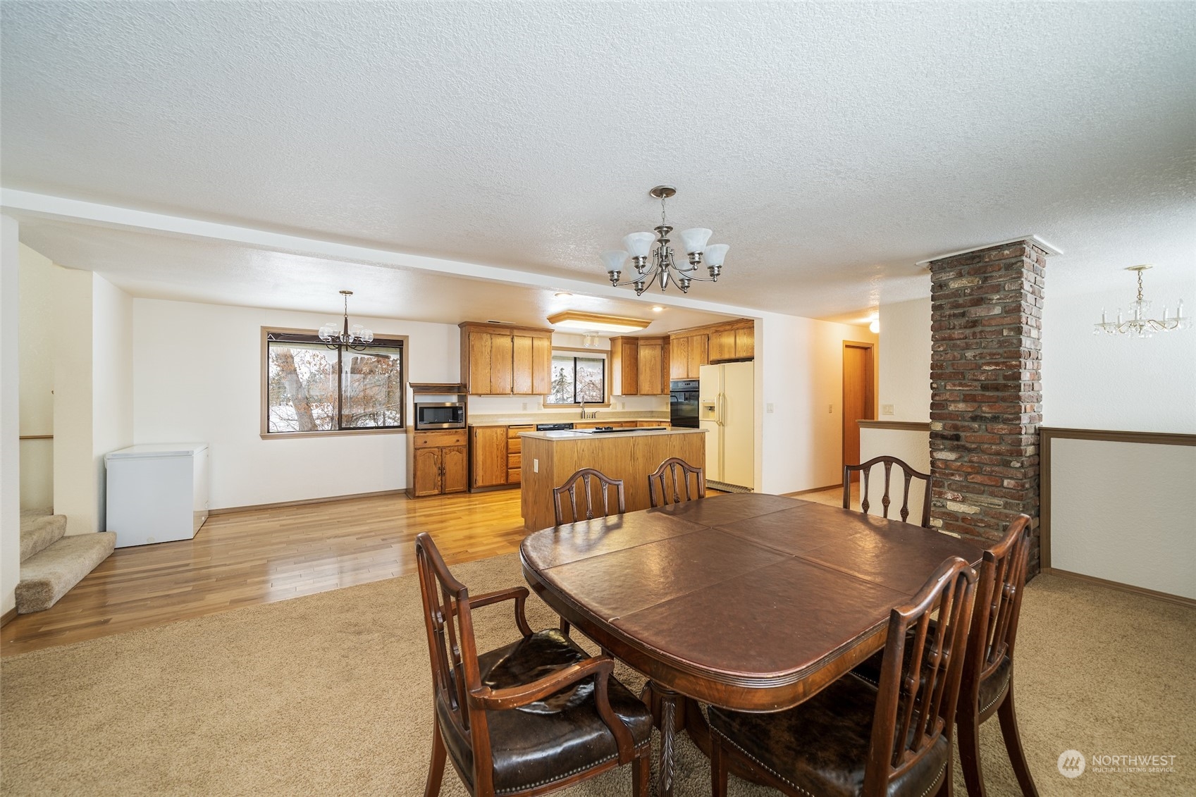 141 Johnson Creek Road Omak, WA 98841 - Photo 10 of 40 a view of a dining room with furniture and chandelier