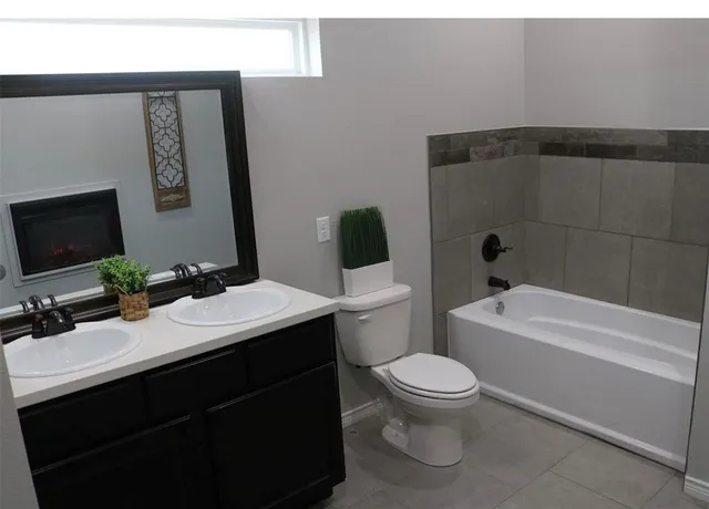 a bathroom with a sink a toilet and a bathtub