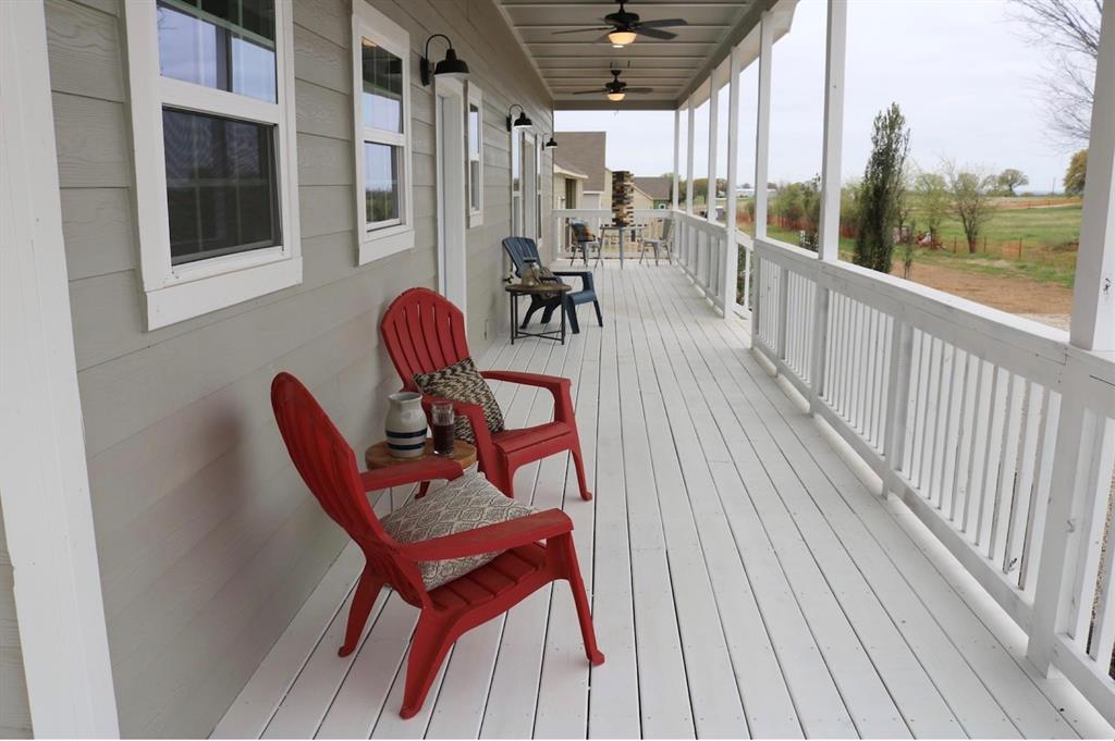 119 Dove Street Boyd, TX 76023 - Photo 12 of 18 a view of a chairs on the roof deck