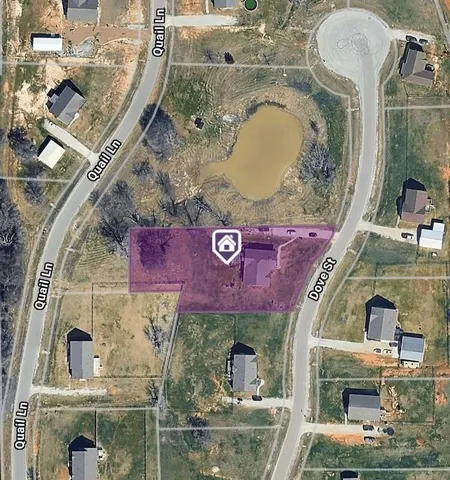 an aerial view of a house with a swimming pool