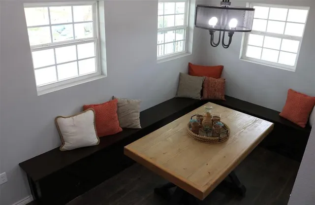 a living room with furniture and window