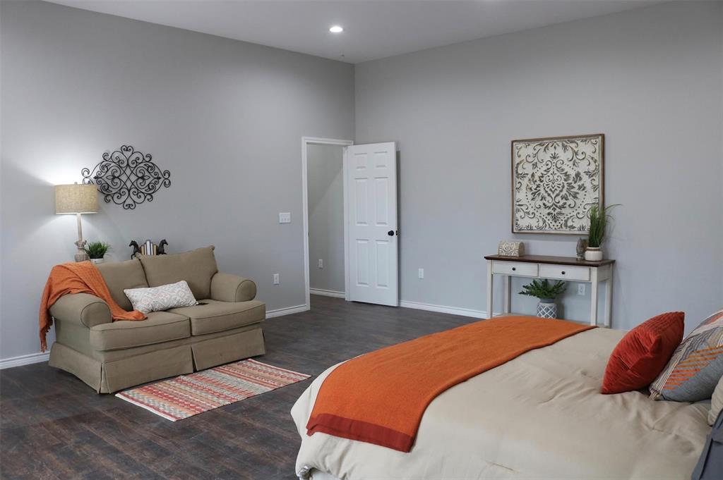 119 Dove Street Boyd, TX 76023 - Photo 9 of 18 a bedroom with a bed and a couch