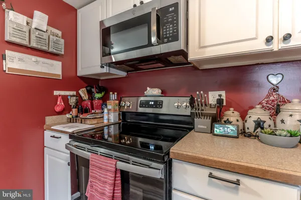 a kitchen with a stove and a microwave
