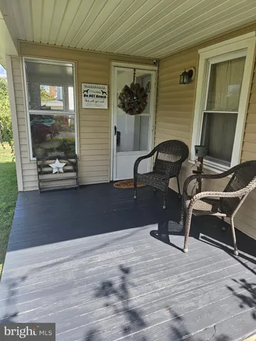 a bedroom with a bed and a mirror
