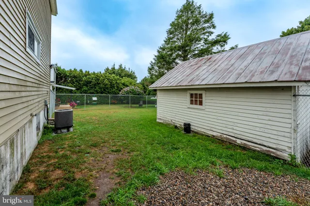 a view of a backyard with potted plants
