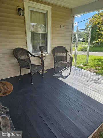 a view of a two chairs in a balcony