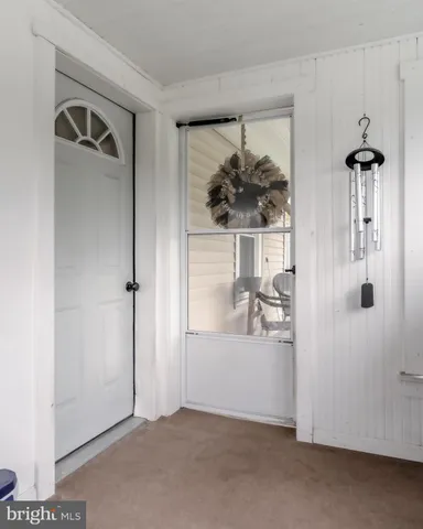 a view of a hallway with closet