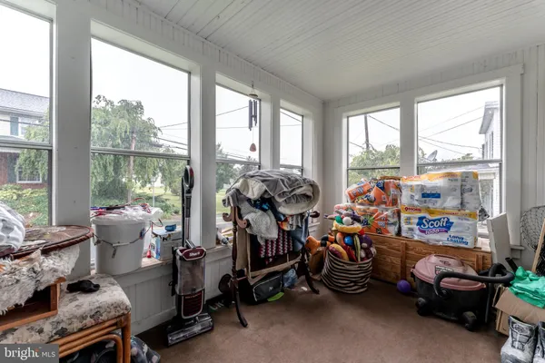a room with furniture toys and a large window