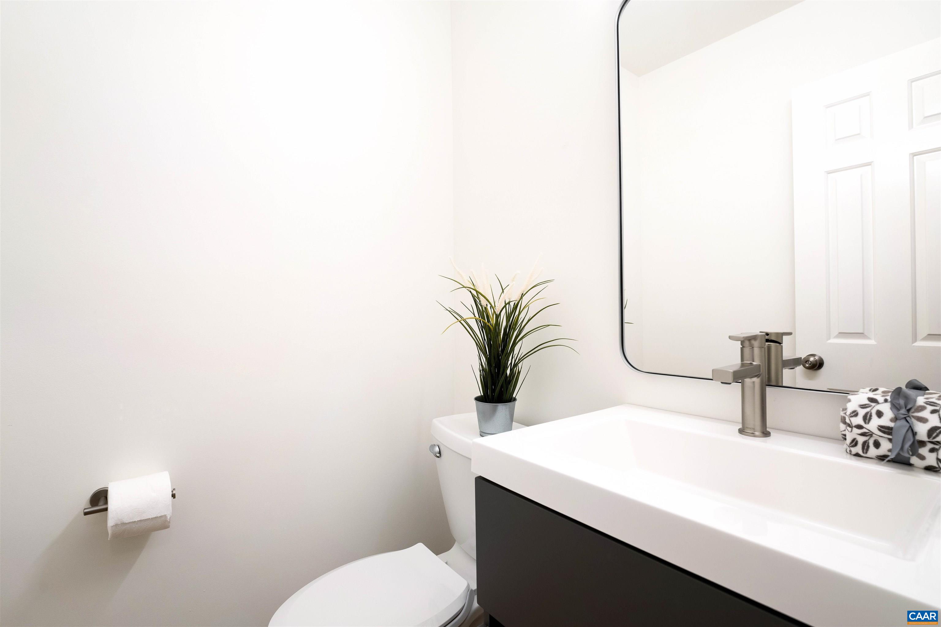 1410 Westwood Road Charlottesville, VA 22903 - Photo 11 of 20 a bathroom with a sink a toilet and mirror