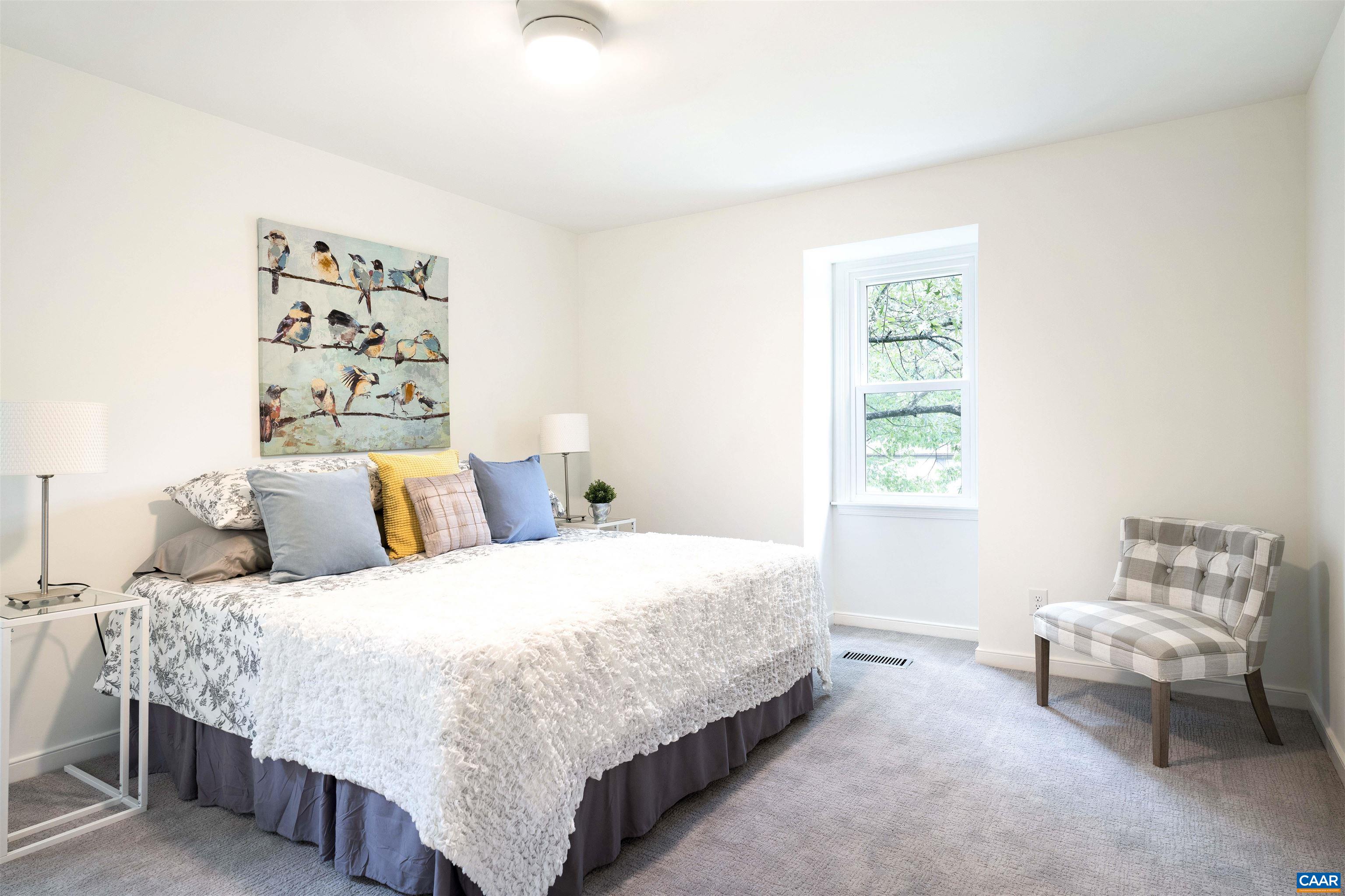 1410 Westwood Road Charlottesville, VA 22903 - Photo 12 of 20 a bedroom with a bed and a couch