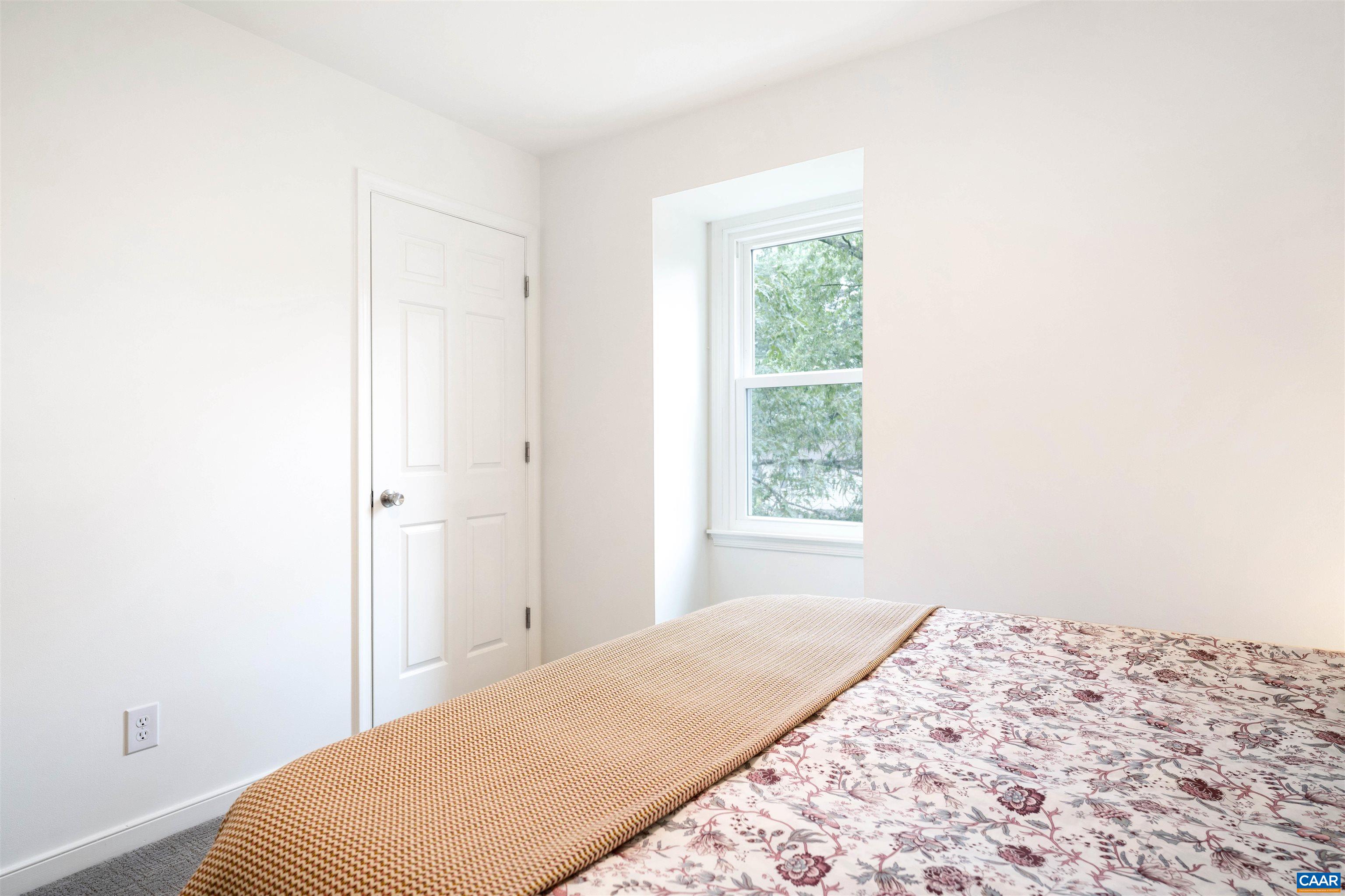 1410 Westwood Road Charlottesville, VA 22903 - Photo 18 of 20 a bedroom with a bed and a window