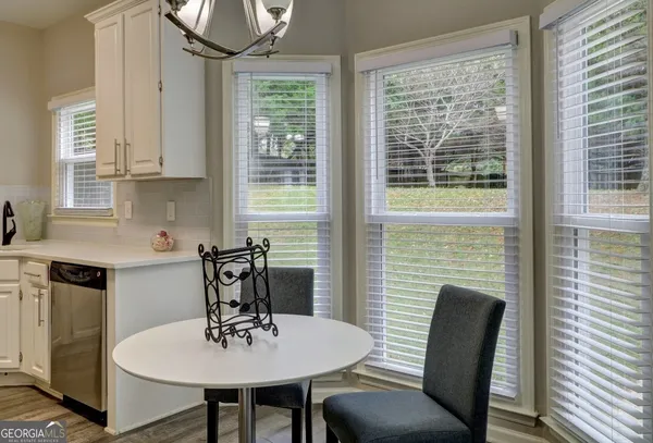 a view of a dining room with furniture window and outside view