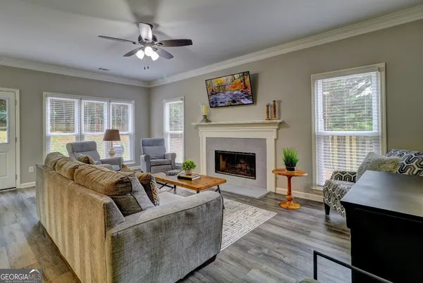 a living room with furniture and a fireplace