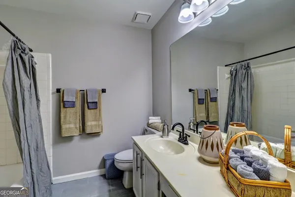 a bathroom with double sink and a mirror