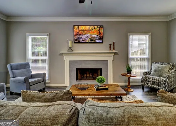a living room with furniture and a fireplace