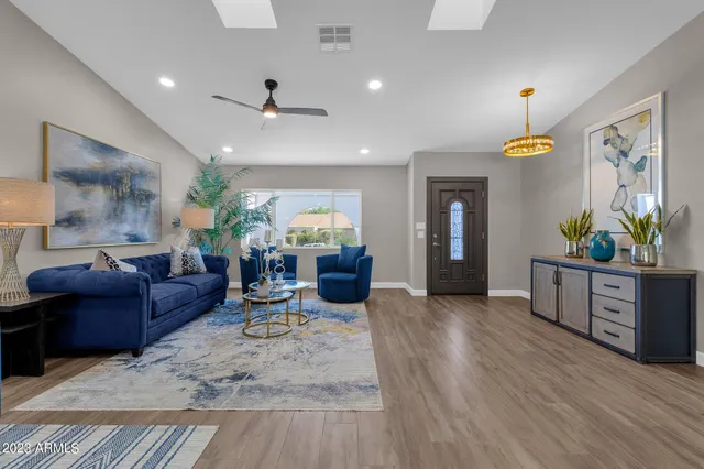 a living room with furniture and a large window