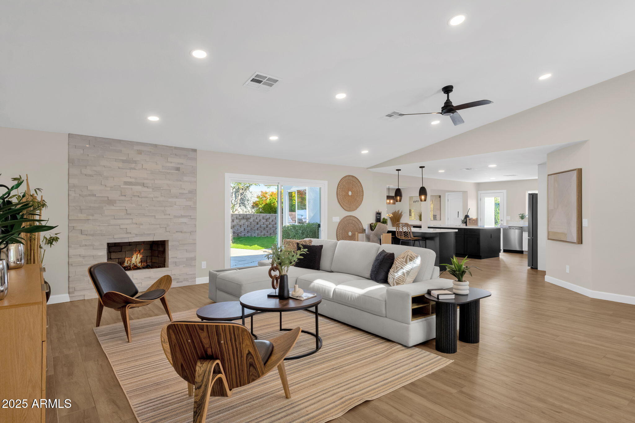 2276 East Mercer Lane Phoenix, AZ 85028 - Photo 20 of 61 a living room with furniture and a fireplace
