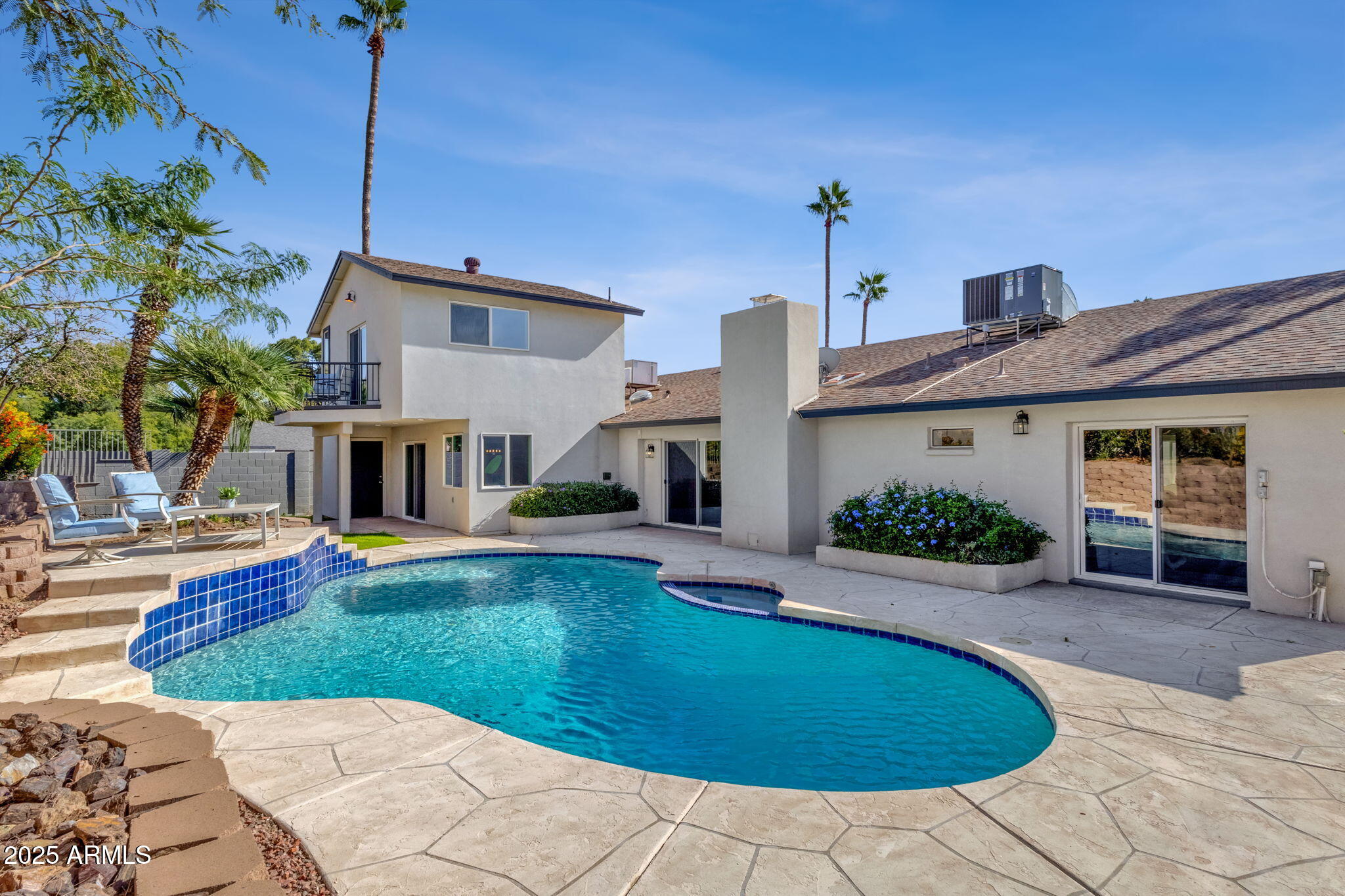 2276 East Mercer Lane Phoenix, AZ 85028 - Photo 2 of 61 a view of a house with swimming pool and a yard