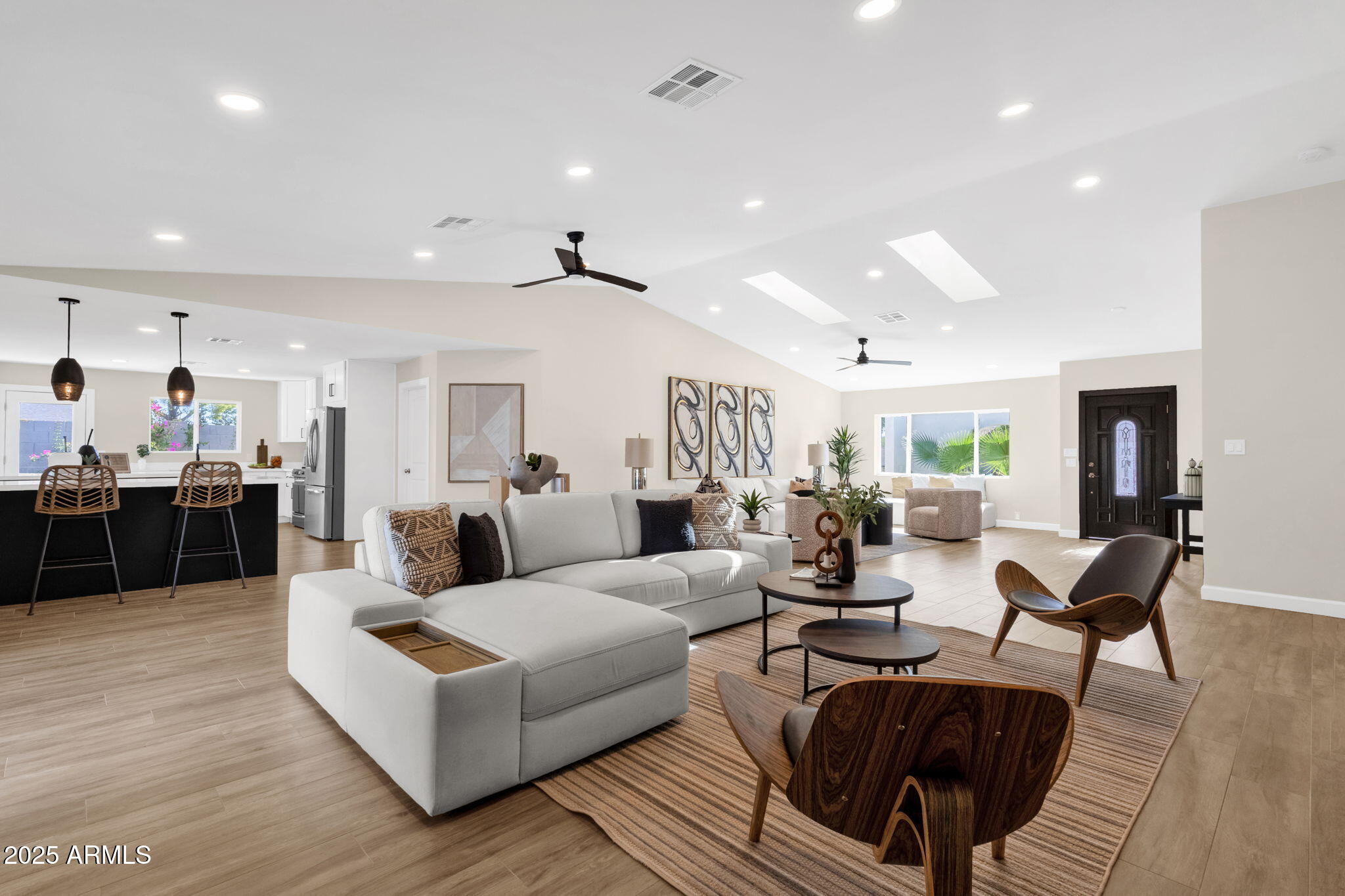 2276 East Mercer Lane Phoenix, AZ 85028 - Photo 21 of 61 a living room with furniture kitchen view and a wooden floor