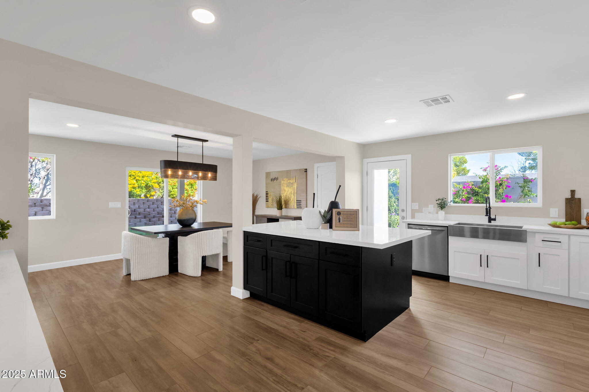 2276 East Mercer Lane Phoenix, AZ 85028 - Photo 26 of 61 a large kitchen with a table and chairs in it