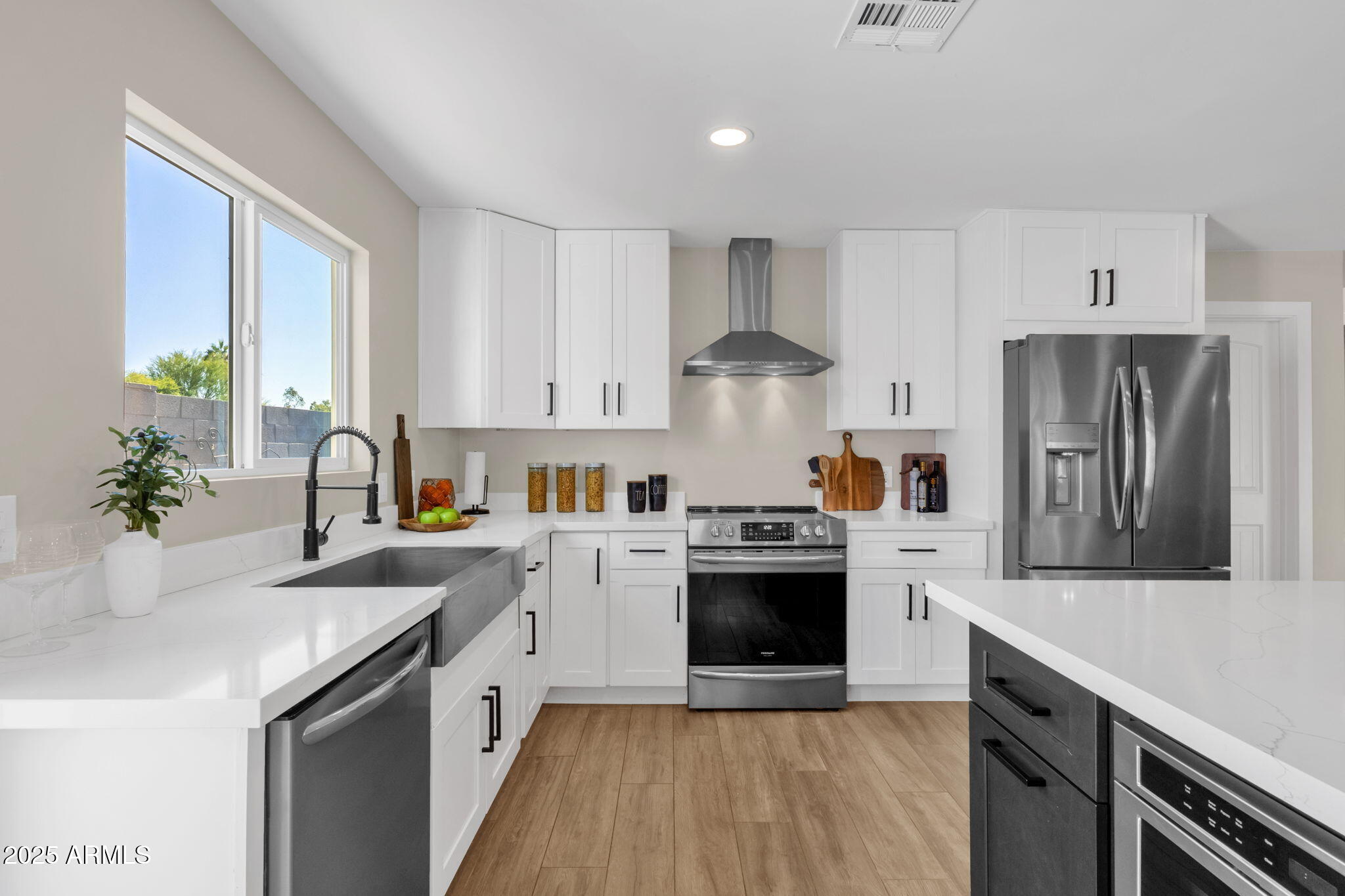 2276 East Mercer Lane Phoenix, AZ 85028 - Photo 31 of 61 a kitchen with stainless steel appliances granite countertop a sink stove and refrigerator