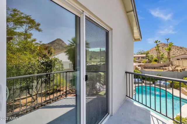 a bedroom with a bed and cabinets