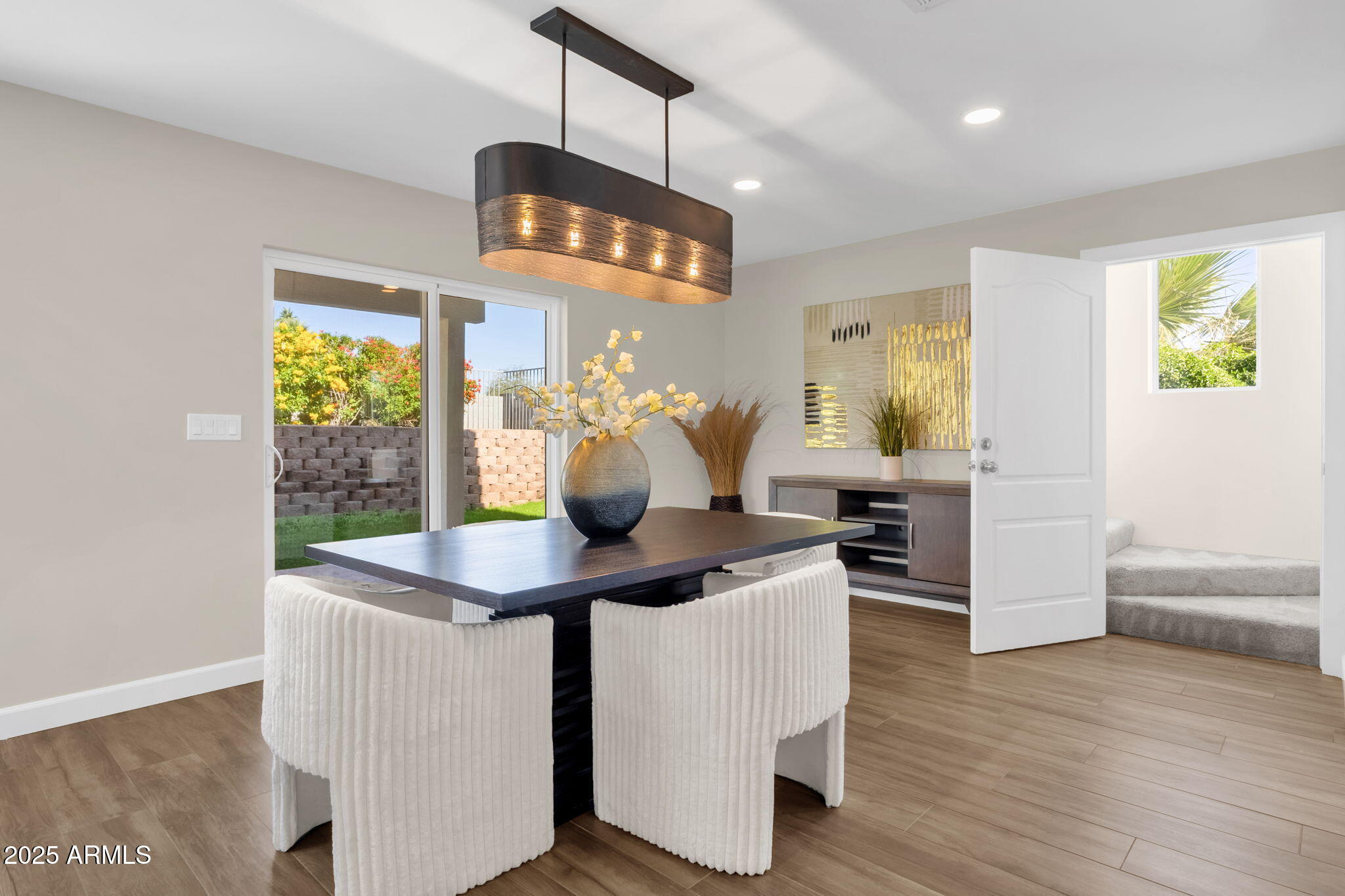 2276 East Mercer Lane Phoenix, AZ 85028 - Photo 34 of 61 a dining room with furniture and wooden floor